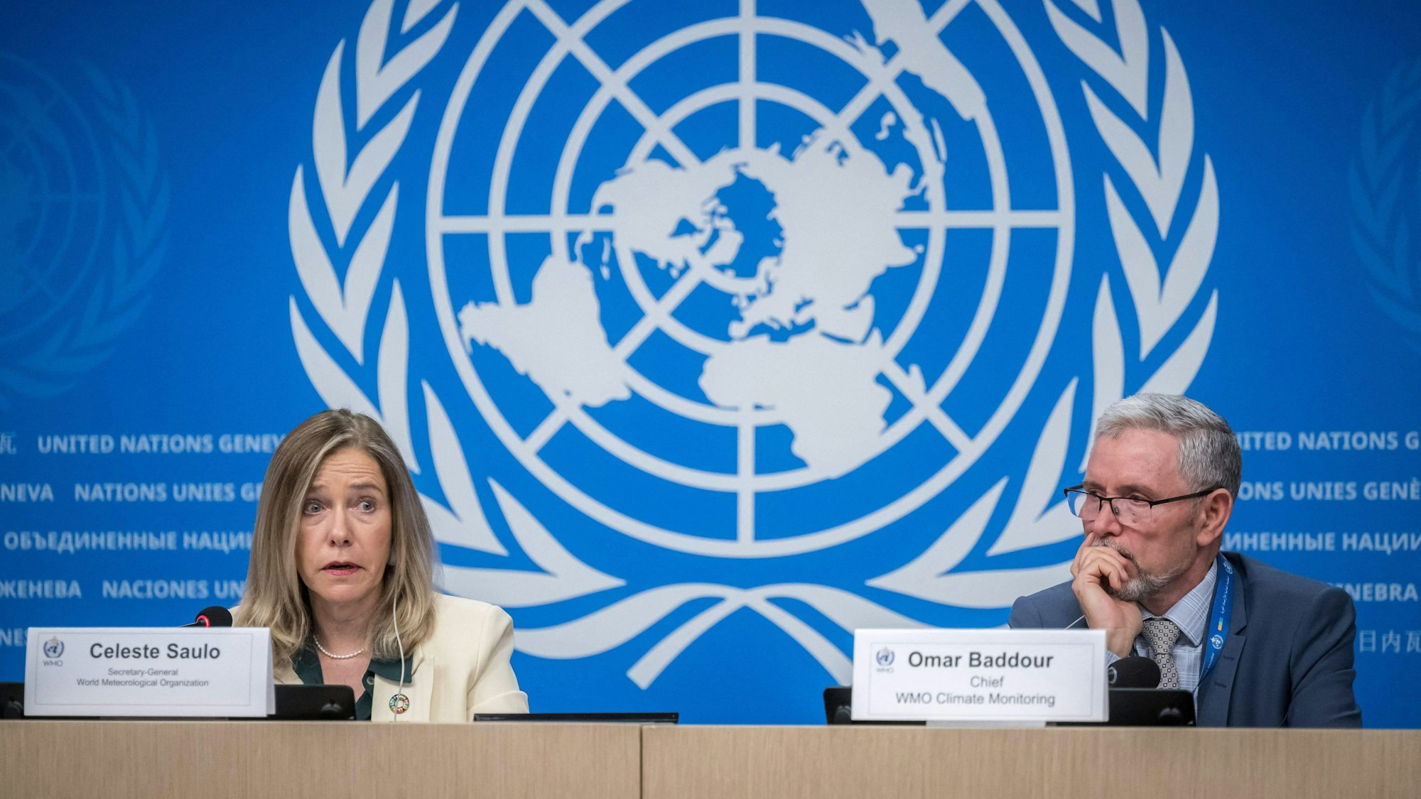 World Meteorological Organization (WMO) Secretary-General Celeste Saulo (L) speaks next to WMO Chief of Climate Monitoring Omar Baddour during a press conference on the WMO's 2023 global climate report in Geneva, on March 19, 2024. Global heat records were "smashed" last year, the UN confirmed, with 2023 rounding out the hottest decade on record, as heatwaves stalked oceans and glaciers suffered record ice loss. (Photo by Fabrice COFFRINI / AFP)