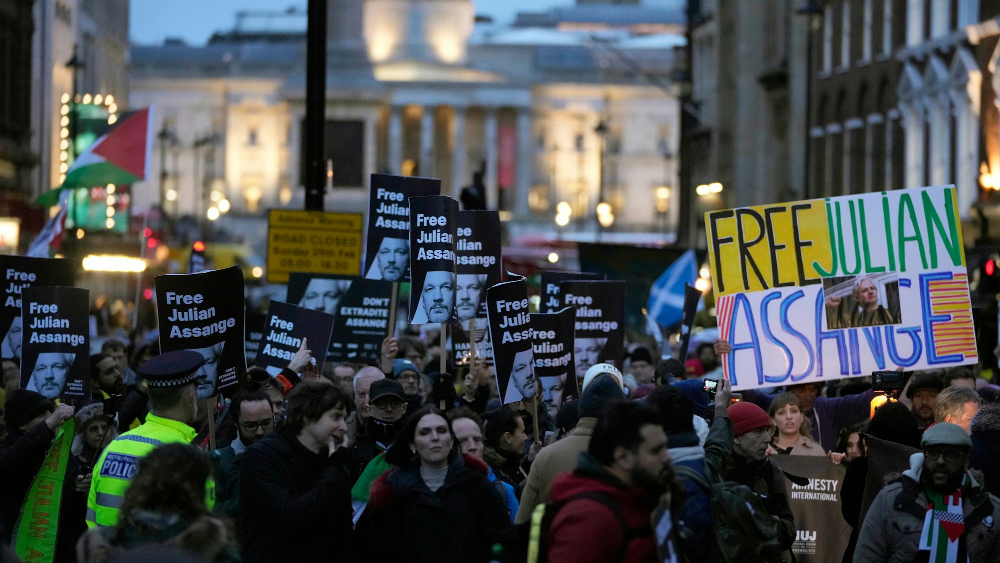 Protesters demanding to free Julian Assange march to Downing Street at the end of a two-day hearing at the Royal Courts of Justice in London, Wednesday, Feb. 21, 2024. The 52-year-old WikiLeaks founder Julian Assange has been fighting extradition for more than a decade, including seven years in self-exile in the Ecuadorian Embassy in London and the last five years in a high-security prison. (AP Photo/Kin Cheung)