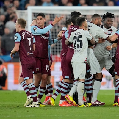 Players scuffle during the Europa League quarterfinal second leg soccer match between West Ham and Bayer 04 Leverkusen in London, Thursday, April 18, 2024.(AP Photo/Kin Cheung)