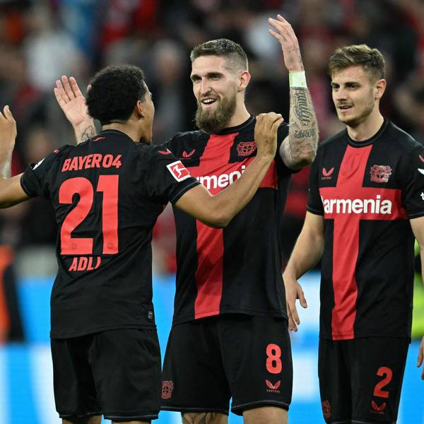 Bayer Leverkusen's French forward #21 Amine Adli, Bayer Leverkusen's German midfielder #08 Robert Andrich and Bayer Leverkusen's Croatian defender #02 Josip Stanisic celebrate after the German first division Bundesliga football match Bayer 04 Leverkusen v VfL Stuttgart in Leverkusen, western Germany, on April 27, 2024. (Photo by INA FASSBENDER / AFP) / DFL REGULATIONS PROHIBIT ANY USE OF PHOTOGRAPHS AS IMAGE SEQUENCES AND/OR QUASI-VIDEO