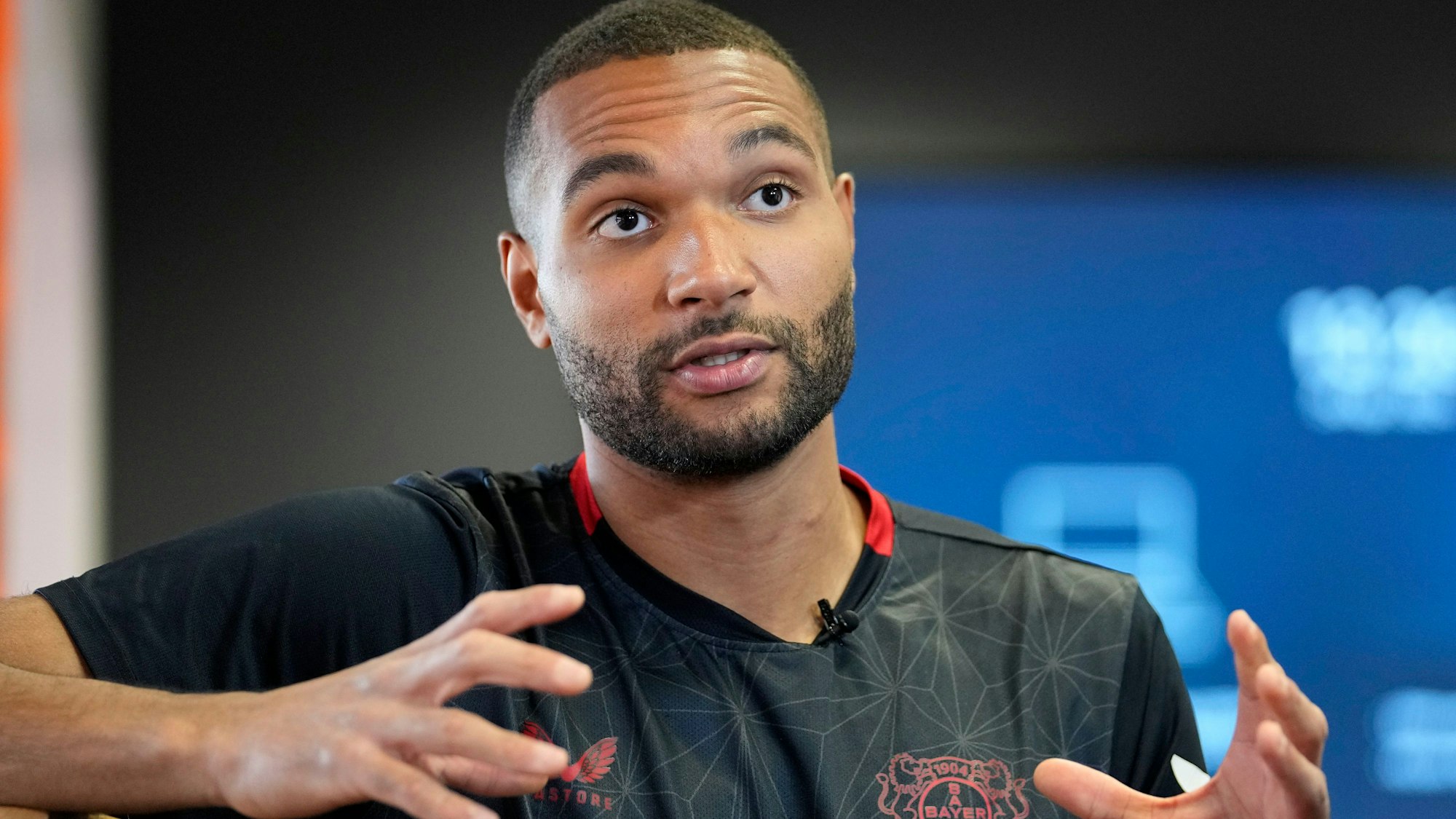 Bayer Leverkusen defender Jonathan Tah talks to The Associated Press during an interview at the BayArena in Leverkusen, Germany, Wednesday, April 24, 2024. Tah won the Bundesliga title already, and has also the chance to win the German Cup and the Europa League this season with Leverkusen. Tah is also defender for Germany's national team. (AP Photo/Martin Meissner)