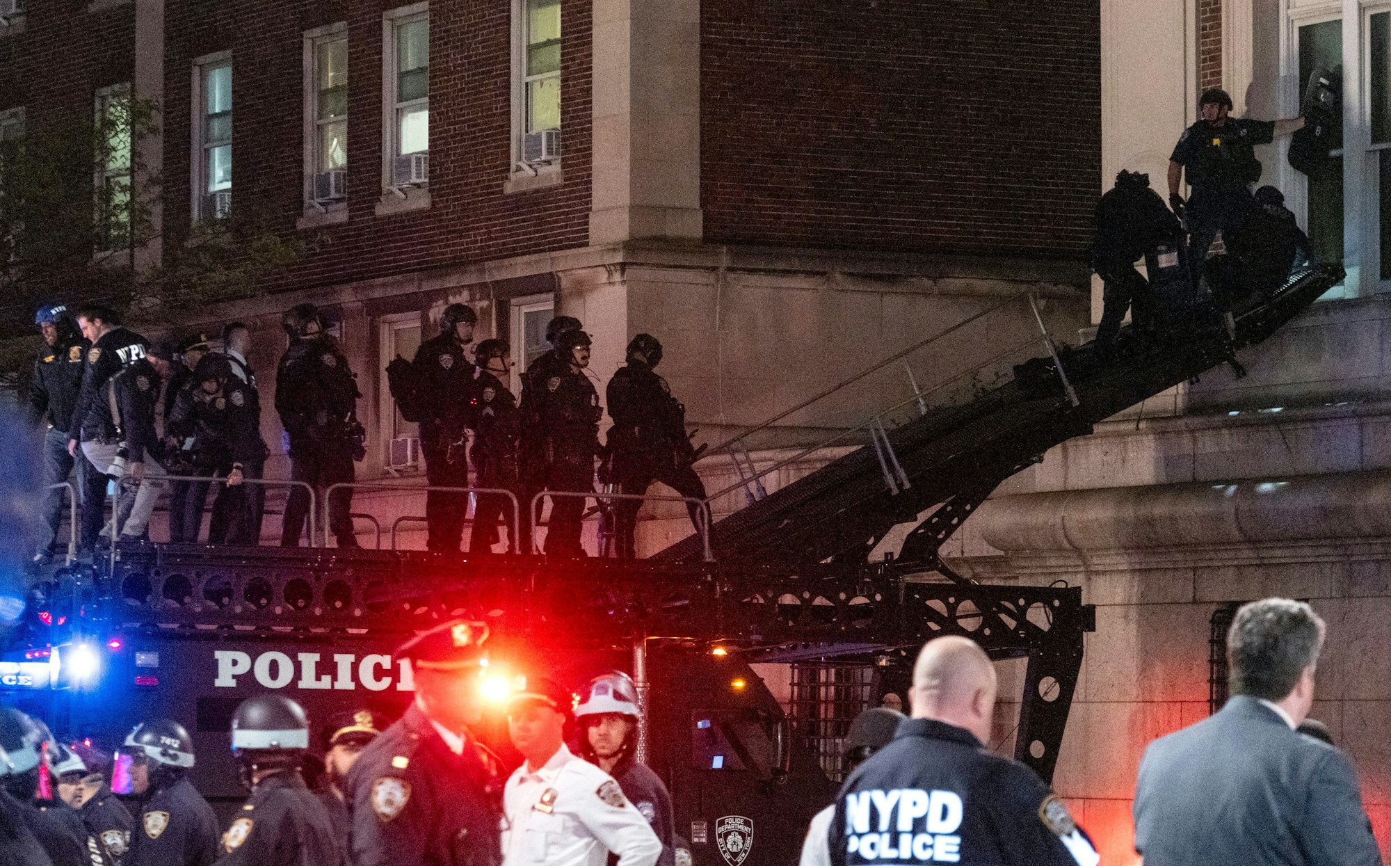 Using a tactical vehicle, New York City police enter an upper floor of Hamilton Hall on the Columbia University campus in New York Tuesday, April 30, 2024, after a building was taken over by protesters earlier Tuesday. Hundreds of police officers swept into Columbia University on Tuesday night to end a pro-Palestinian occupation of an administration building and sweep away a protest encampment, acting after the school’s president said there was no other way to ensure safety and restore order on campus.(AP Photo/Craig Ruttle)