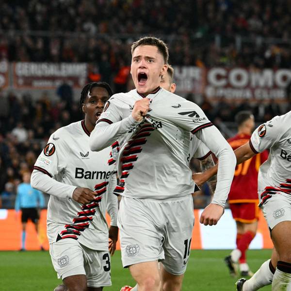 Bayer Leverkusen's German midfielder #10 Florian Wirtz celebrates with teammates after scoring his team first goal during the UEFA Europa League semi final first leg football match between AS Roma and Bayern Leverkusen at the Olympic stadium on May 2, 2024 in Rome. (Photo by Alberto PIZZOLI / AFP)