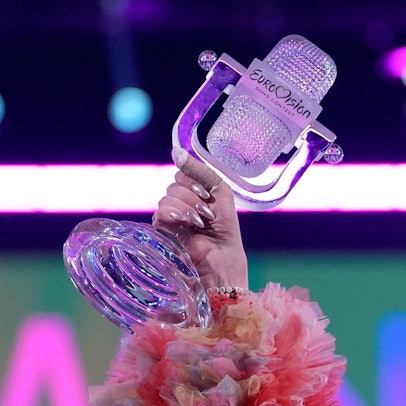 Nemo of Switzerland, who performed the song The Code, celebrates holding the trophy after winning the Grand Final of the Eurovision Song Contest in Malmo, Sweden, Sunday, May 12, 2024. (AP Photo/Martin Meissner)