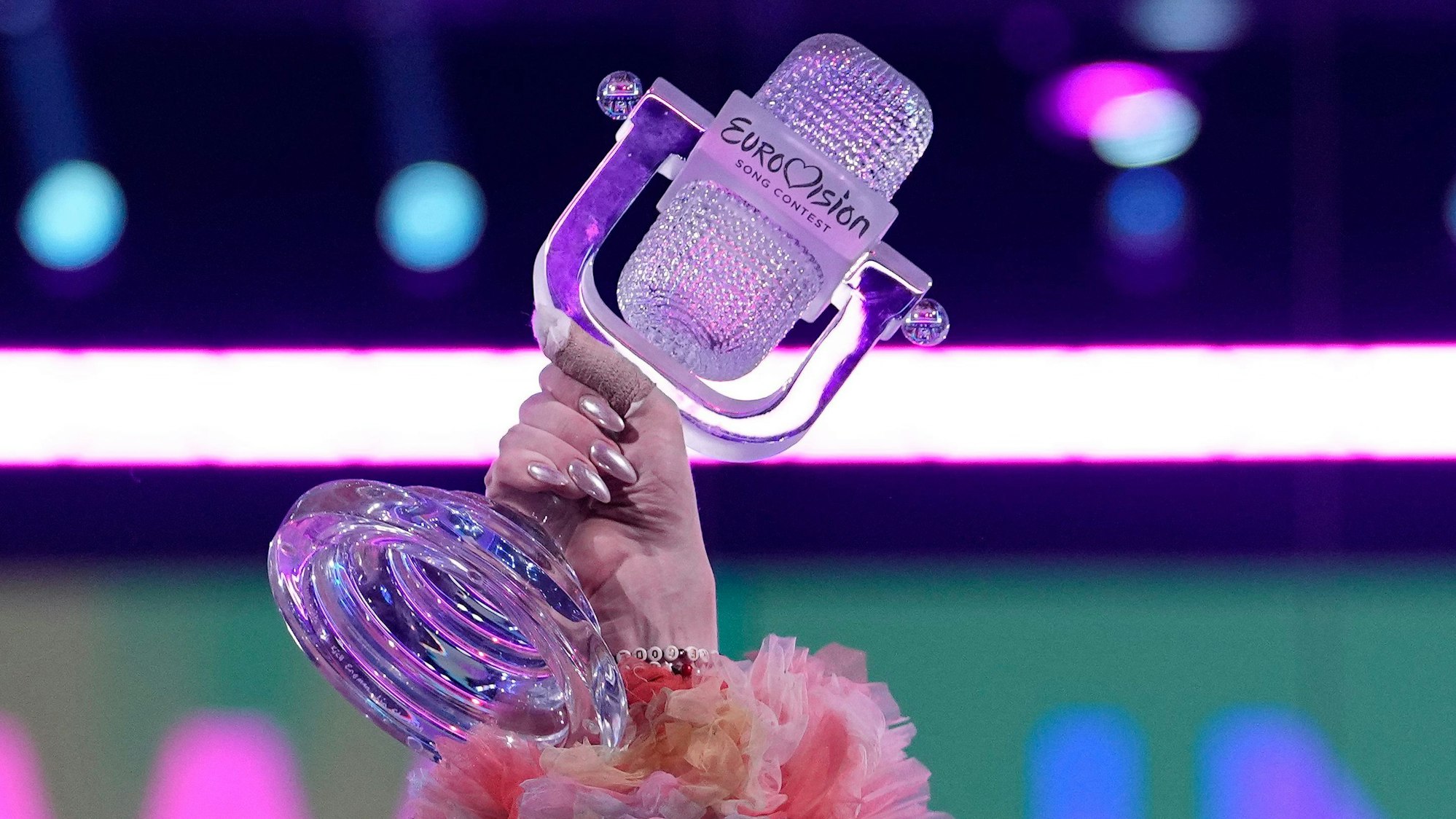 Nemo of Switzerland, who performed the song The Code, celebrates holding the trophy after winning the Grand Final of the Eurovision Song Contest in Malmo, Sweden, Sunday, May 12, 2024. (AP Photo/Martin Meissner)