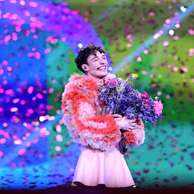 Swiss singer Nemo representing Switzerland with the song "The Code" celebrates on stage after winning the final of the 68th Eurovision Song Contest (ESC) 2024 on May 11, 2024 at the Malmo Arena in Malmo, Sweden. (Photo by Tobias SCHWARZ / AFP)