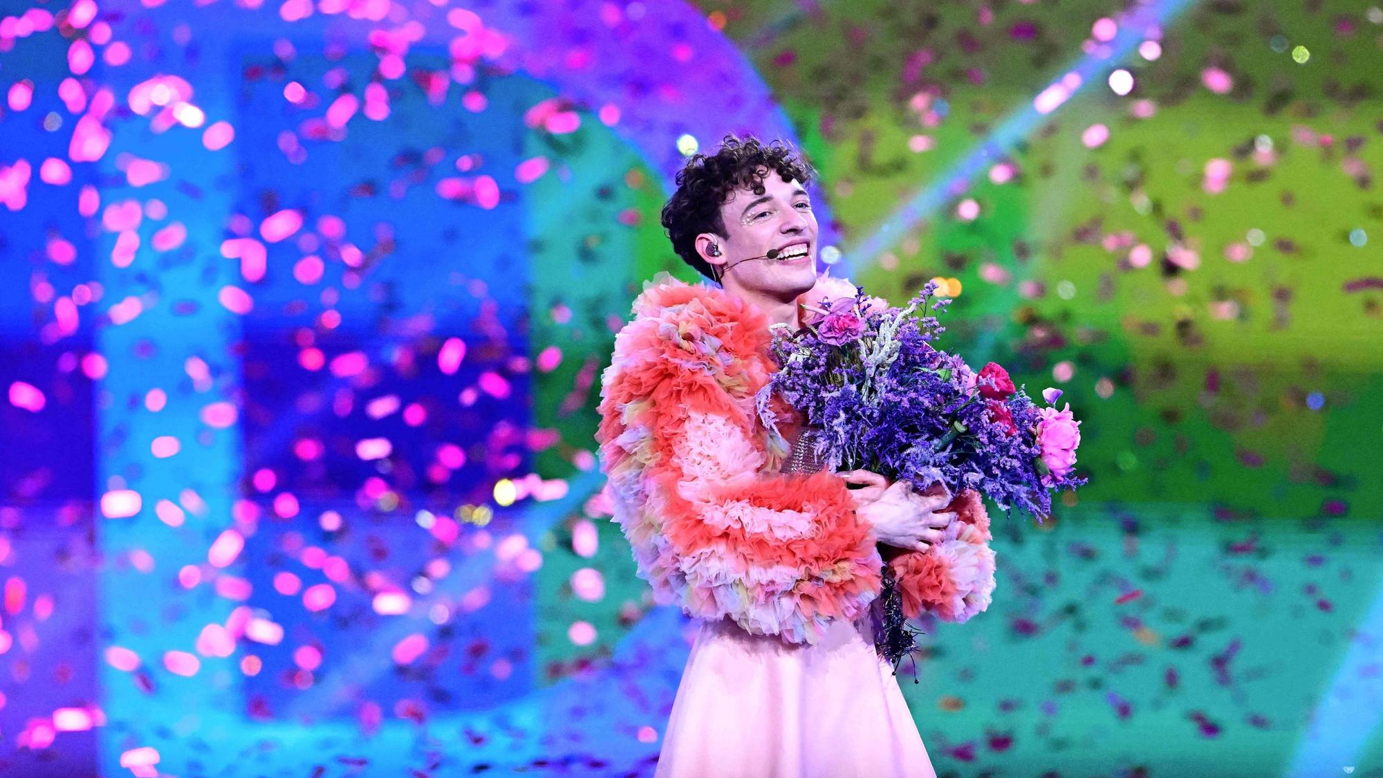 Swiss singer Nemo representing Switzerland with the song "The Code" celebrates on stage after winning the final of the 68th Eurovision Song Contest (ESC) 2024 on May 11, 2024 at the Malmo Arena in Malmo, Sweden. (Photo by Tobias SCHWARZ / AFP)