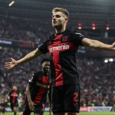 Bayer Leverkusen's Croatian defender #02 Josip Stanisic celebrates scoring the 2-2 during the UEFA Europa League semi final second leg football match between Bayer Leverkusen and ASC Roma in Leverkusen, on May 9, 2024. (Photo by INA FASSBENDER / AFP)