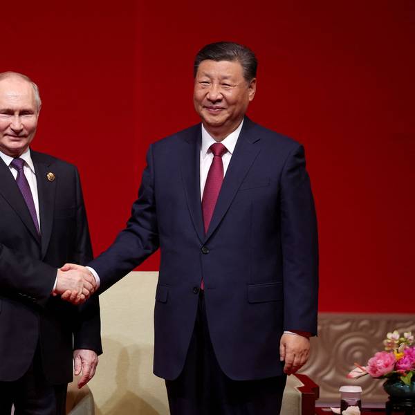 TOPSHOT - In this pool photograph distributed by the Russian state agency Sputnik, Russia's President Vladimir Putin and China's President Xi Jinping attend a concert marking the 75th anniversary of the establishment of diplomatic relations between Russia and China and opening of China-Russia Years of Culture at the National Centre for the Performing Arts in Beijing on May 16, 2024. (Photo by Alexander RYUMIN / POOL / AFP) / ** Editor's note : this image is distributed by Russian state owned agency Sputnik **