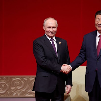 TOPSHOT - In this pool photograph distributed by the Russian state agency Sputnik, Russia's President Vladimir Putin and China's President Xi Jinping attend a concert marking the 75th anniversary of the establishment of diplomatic relations between Russia and China and opening of China-Russia Years of Culture at the National Centre for the Performing Arts in Beijing on May 16, 2024. (Photo by Alexander RYUMIN / POOL / AFP) / ** Editor's note : this image is distributed by Russian state owned agency Sputnik **