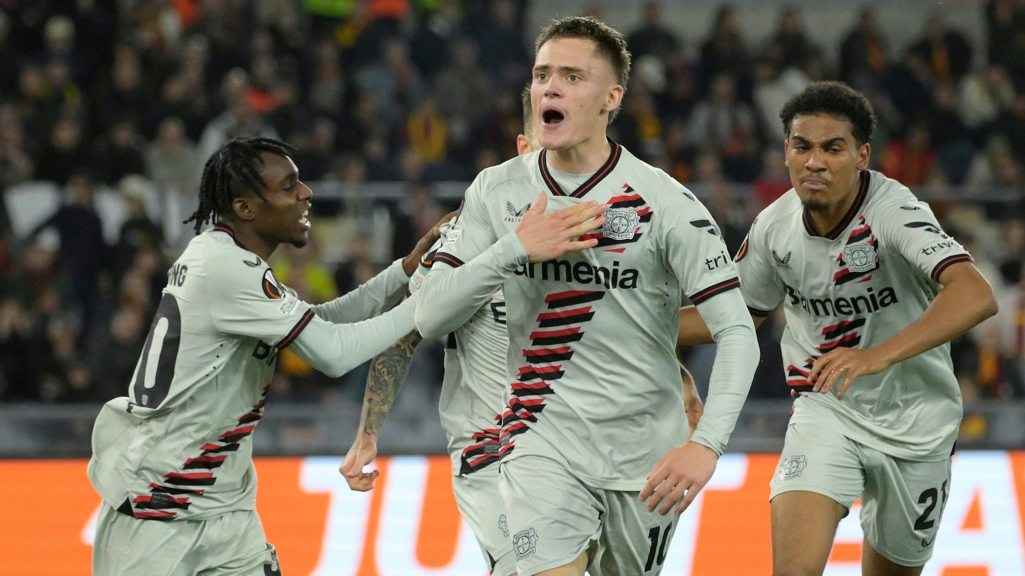 Leverkusen's Florian Wirtz celebrates after scoring their side's first goal of the game during the UEFA Europa League semifinal first leg soccer match between AS Roma and Bayer 04 Leverkusen at the Olympic stadium in Rome, Italy, Thursday, May 2, 2024. (Fabrizio Corradetti/LaPresse via AP)