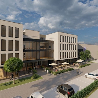 Eine Computervisualisierung. Im Vordergrund ein modernes Bürogebäude mit vier Etagen; davor Parkplätze und eine Außengastronomie. Rechts anschließend eine Sporthalle.