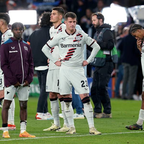 Bayer Leverkusen's Jeremie Frimpong, Adam Hlozek and Amine Adli, from left, react after the team's Europa League final against Atalanta on Wednesday May 22, 2024, in Dublin, Ireland. (Brian Lawless/PA via AP)