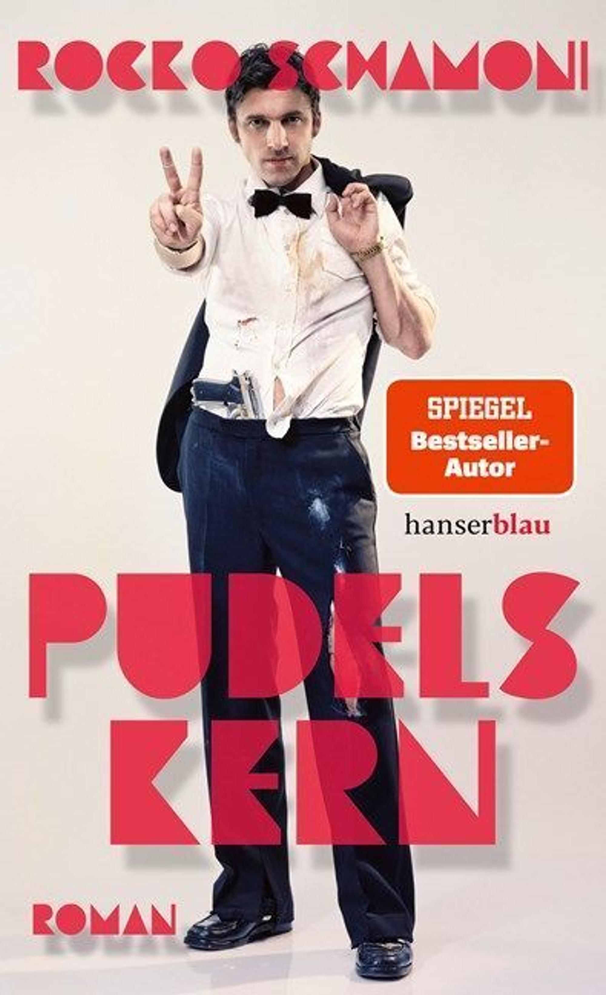 Auf dem Cover zu sehen ist Rocko Schamoni, Buchtitel und Autorname stehen in roten Lettern.