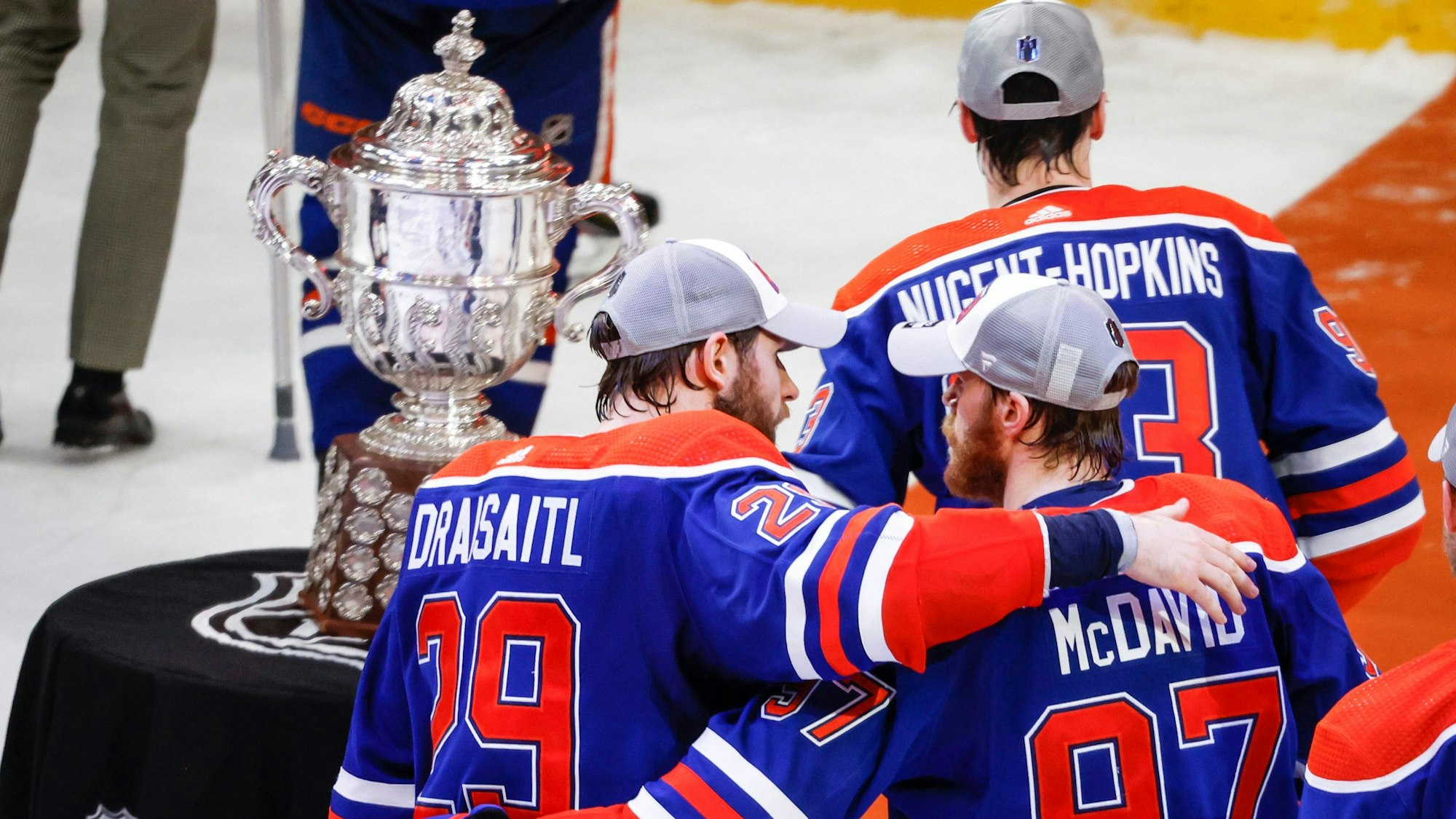 Edmonton Oilers forward Connor McDavid (97) and forward Leon Draisaitl (29) embrace after defeating the Dallas Stars in Game 6 of the Western Conference finals of the NHL hockey Stanley Cup playoffs in Edmonton, Alberta, Sunday, June 2, 2024. (Jeff McIntosh/The Canadian Press via AP)
