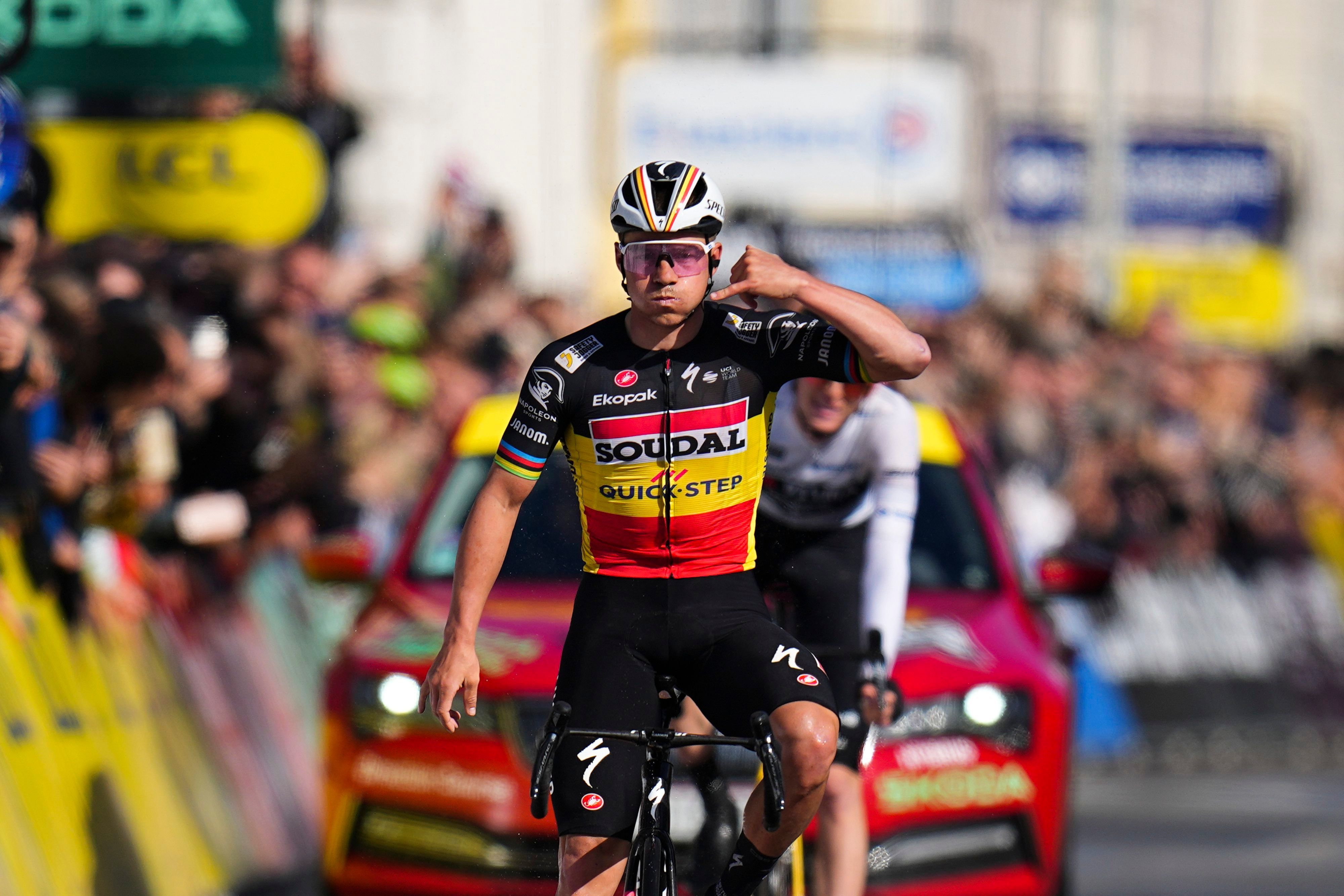 FILE - Belgium's Remco Evenepoel celebrates as he crosses the finish line to win the eighth and final stage of the Paris-Nice cycling race in Nice, on March 10, 2024. Tour de France favorites Remco Evenepoel and Primoz Roglic were caught up in a massive crash Thursday June 6, 2024 at the Criterium du Dauphine race that led organizers to neutralize the stage. (AP Photo/Daniel Cole, File)