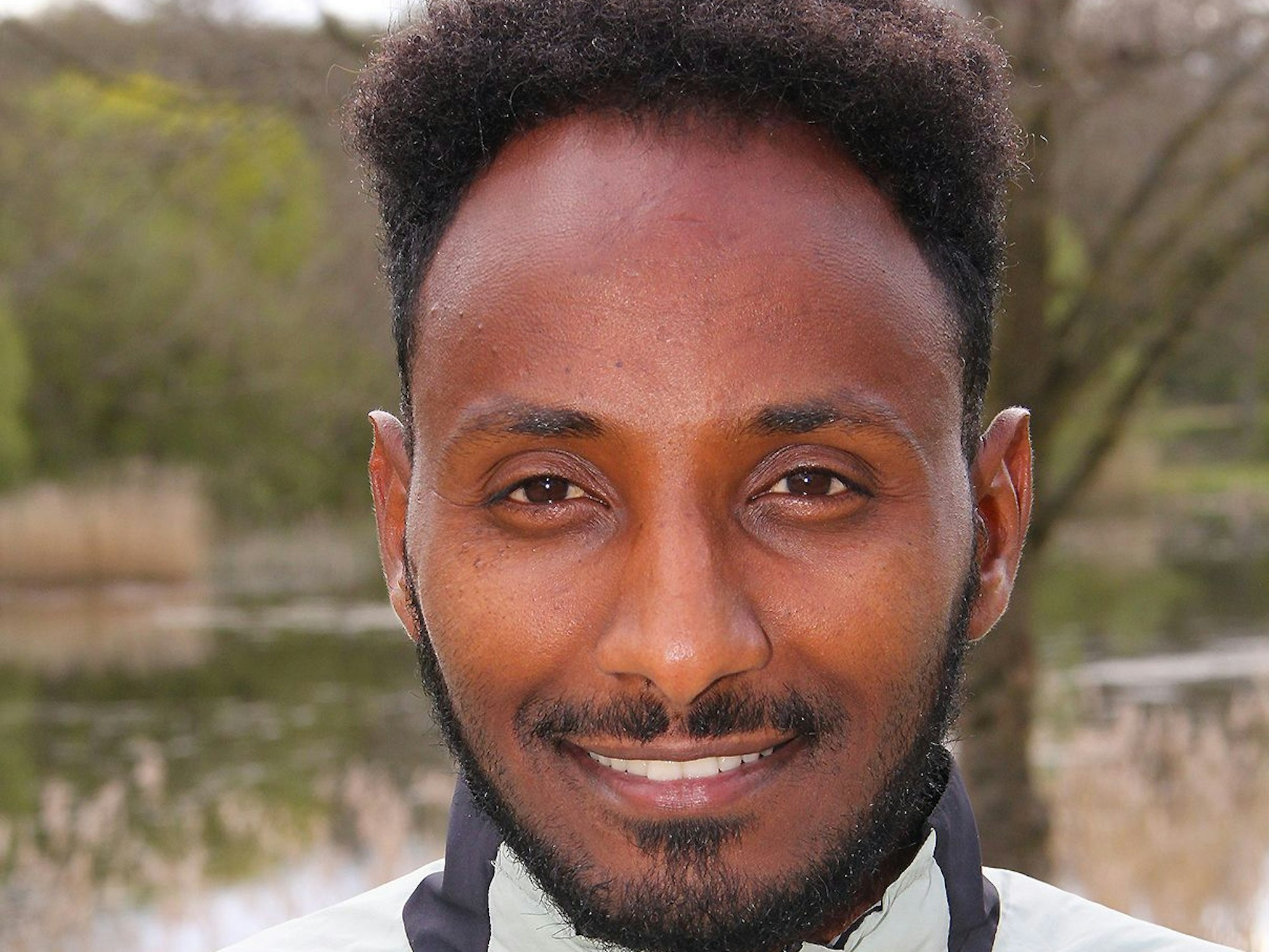 Ein Porträtbild von Samuel Fitwi Sibathu.