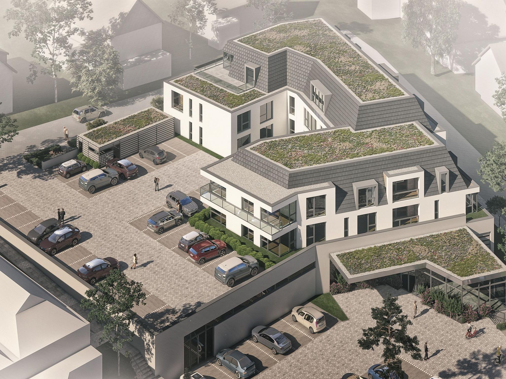Supermarkt mit Parkflächen und Wohnungen