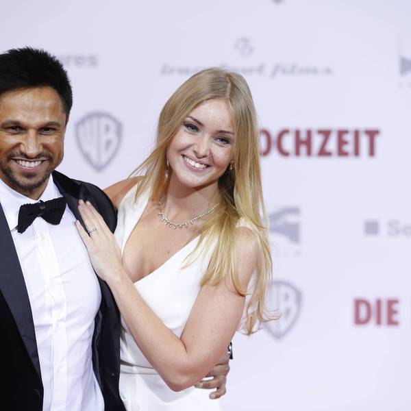 Daniel Aminati und seine Ehefrau Patrice lachen auf dem roten Teppich.
