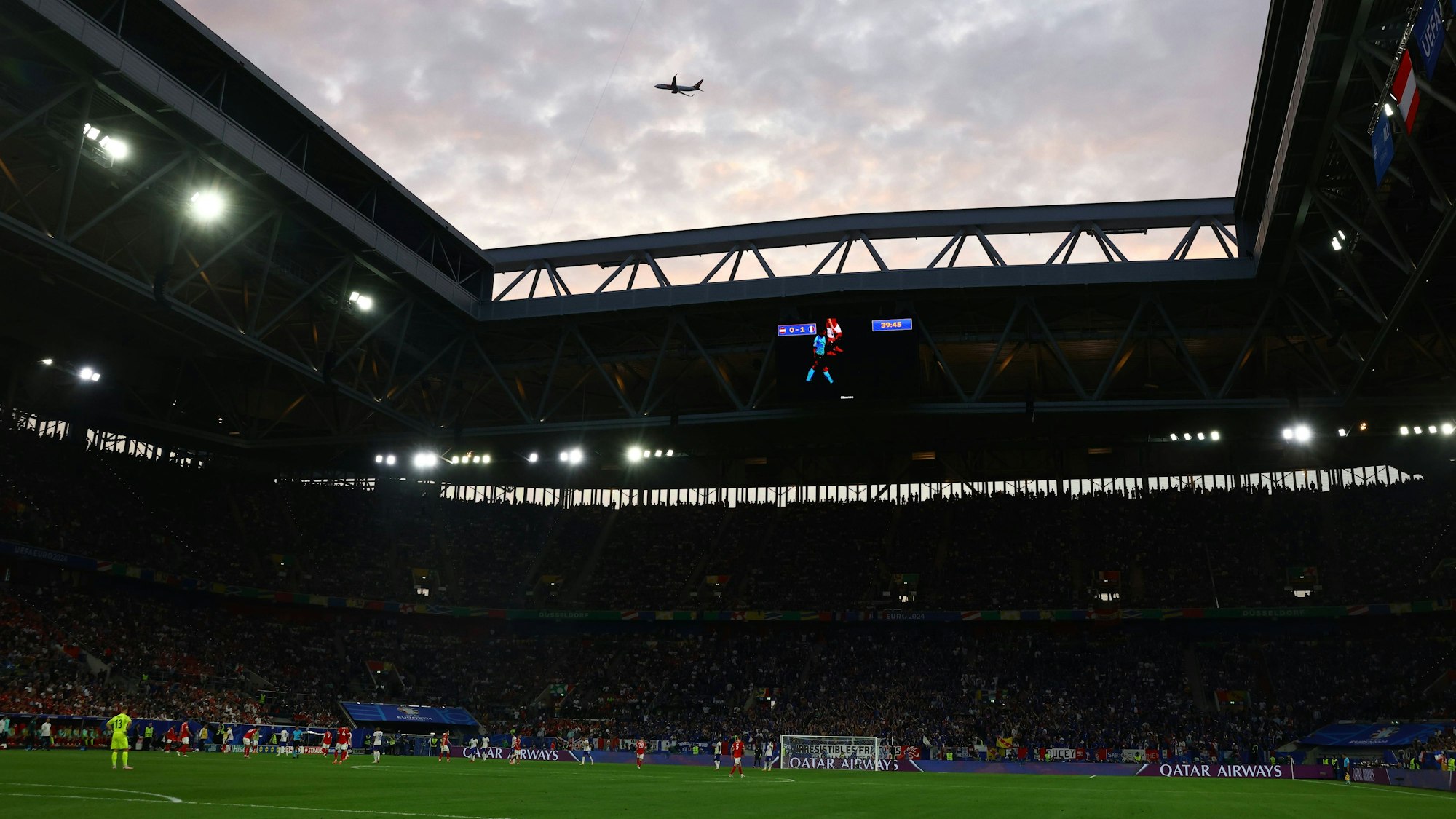 Dusseldorf, Germany, 17th June 2024. An aircraft takes off over the stadium during the UEFA European Championships match at Dusseldorf Arena, Dusseldorf. Picture credit should read: David Klein / Sportimage EDITORIAL USE ONLY. No use with unauthorised audio, video, data, fixture lists, club/league logos or live services. Online in-match use limited to 120 images, no video emulation. No use in betting, games or single club/league/player publications. SPI-3197-0049