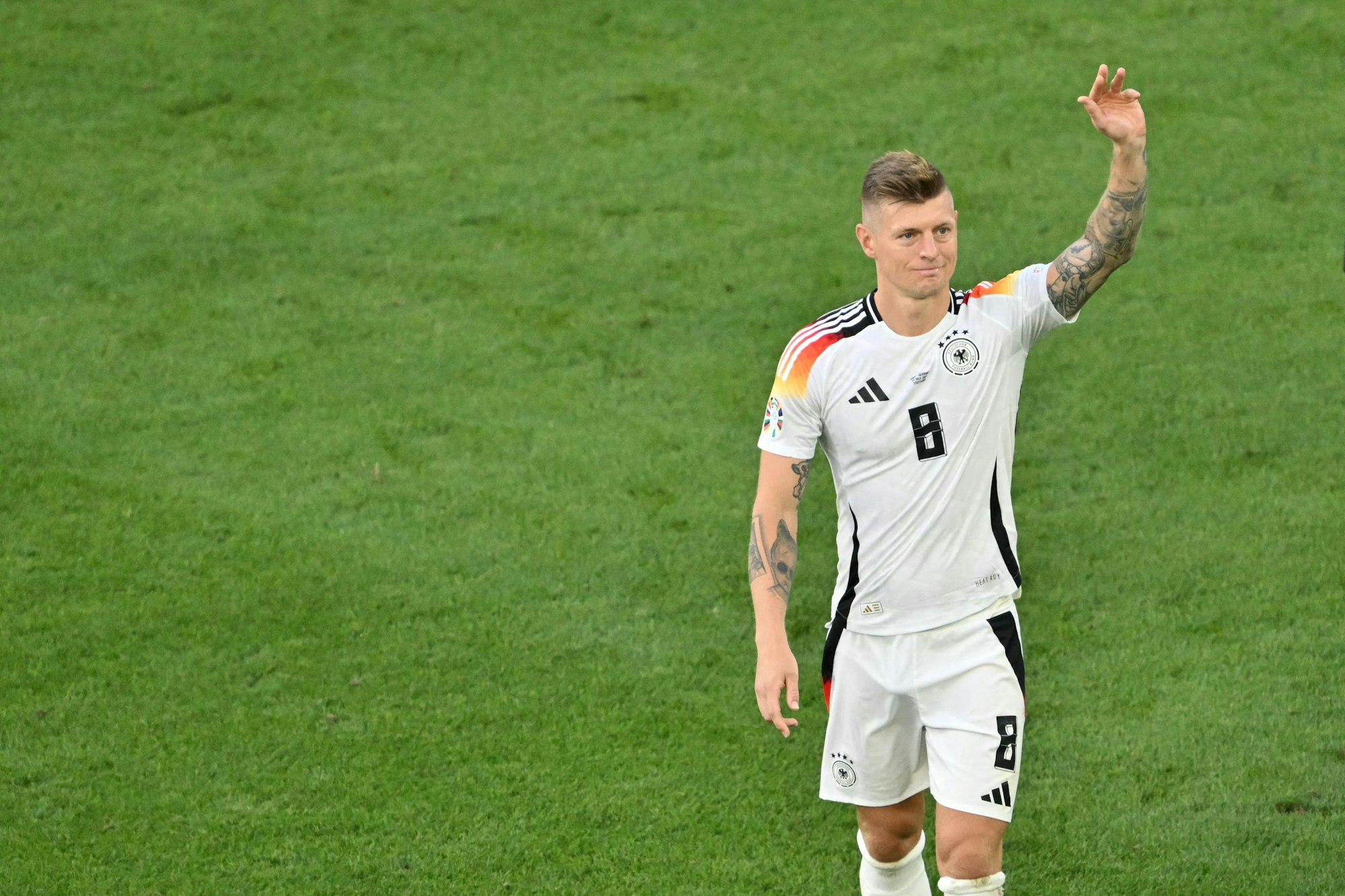 Germany's midfielder #08 Toni Kroos waves after the UEFA Euro 2024 quarter-final football match between Spain and Germany at the Stuttgart Arena in Stuttgart on July 5, 2024. (Photo by MIGUEL MEDINA / AFP)