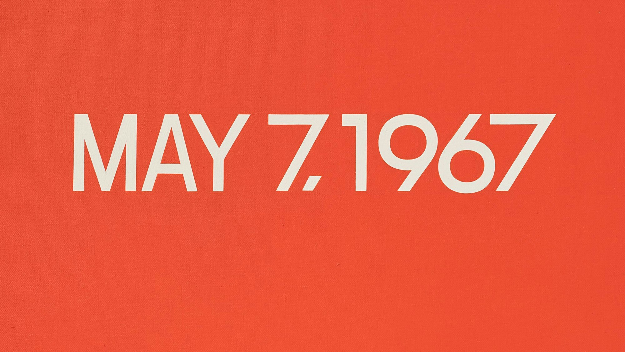Ein Datum steht in weißer Schrift auf rotem Grund.