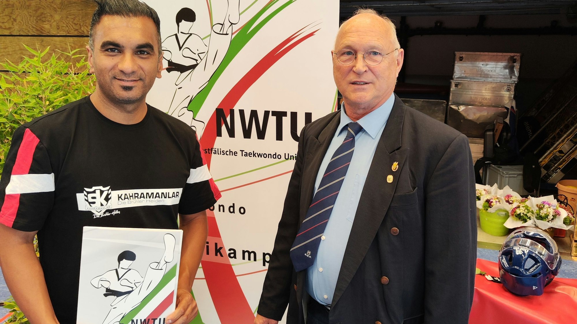 Zu sehen sind Fatih Türk und Thomas Schneider.