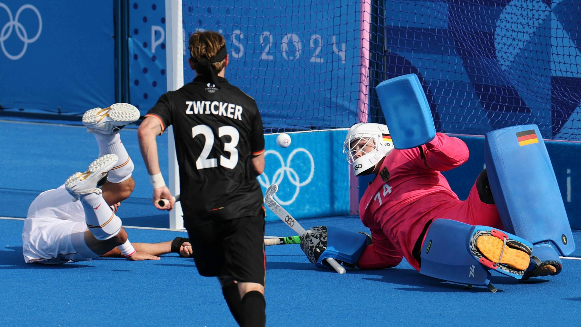 Germany's goalkeeper #74 Jean-Paul Danneberg saves a shot in the men's pool A field hockey match between Germany and Spain during the Paris 2024 Olympic Games at the Yves-du-Manoir Stadium in Colombes on July 28, 2024. (Photo by Ahmad GHARABLI / AFP)