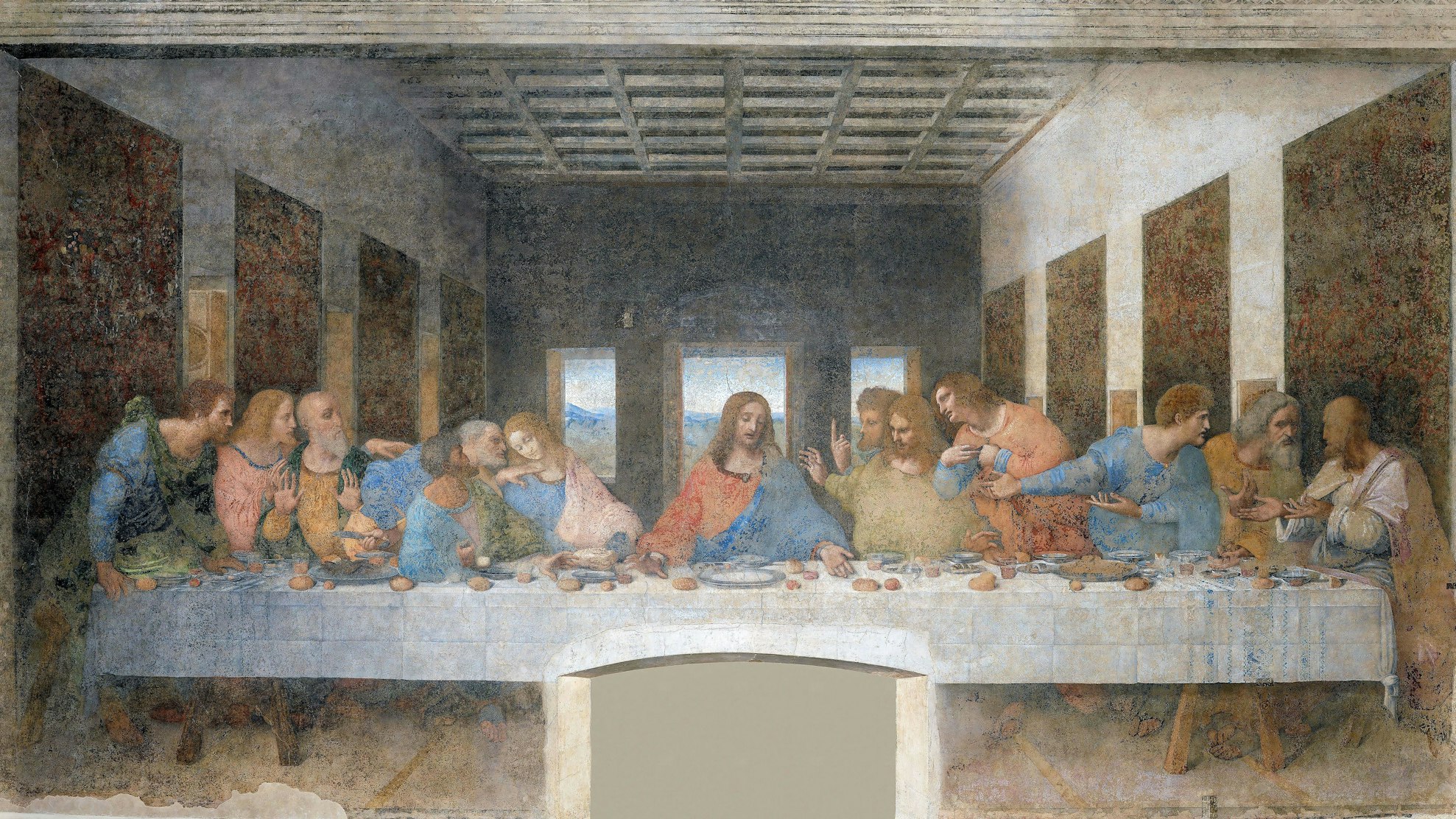 Christus sitzt mit seinen Jüngern an einem Tisch.
