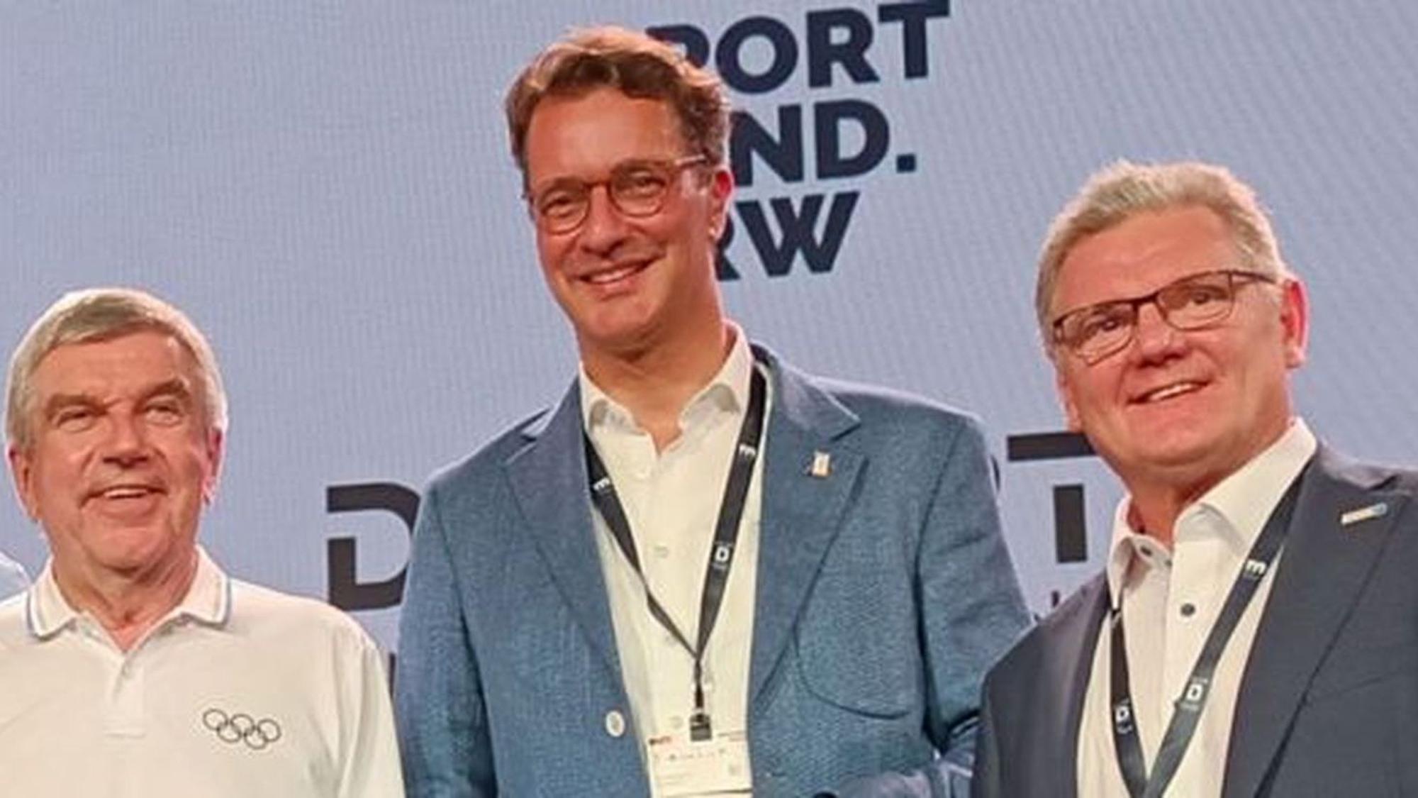Bei den Olympischen Spielen in Paris: IOC-Präsident Thomas Bach, NRW-Ministerpräsident Hendrik Wüst und NRW-Landesportbund-Präsident Stefan Klett. (v.l.)
