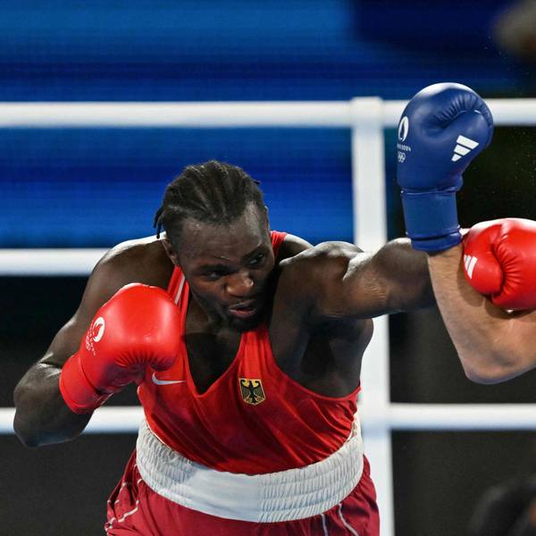 Germany's Nelvie Raman Tiafack and Uzbekistan's Bakhodir Jalolov (Blue) compete in the men's +92kg semi-final boxing match during the Paris 2024 Olympic Games at the Roland-Garros Stadium, in Paris on August 7, 2024. (Photo by MOHD RASFAN / AFP)