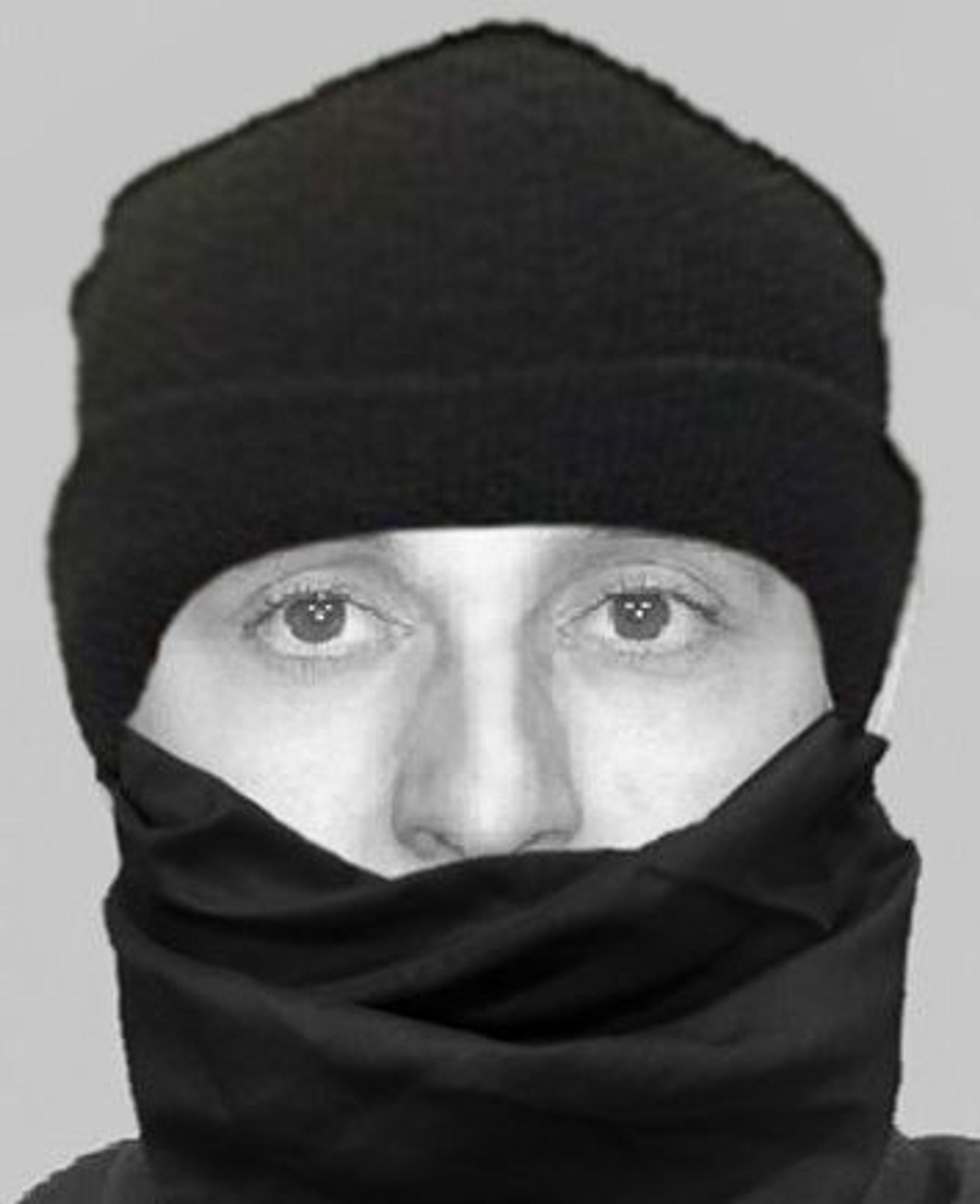 Das Schwarz-Weiß-Bild zeigt einen vermummten Mann, von dem nur die Augen- und Nasenpartie zu sehen ist.