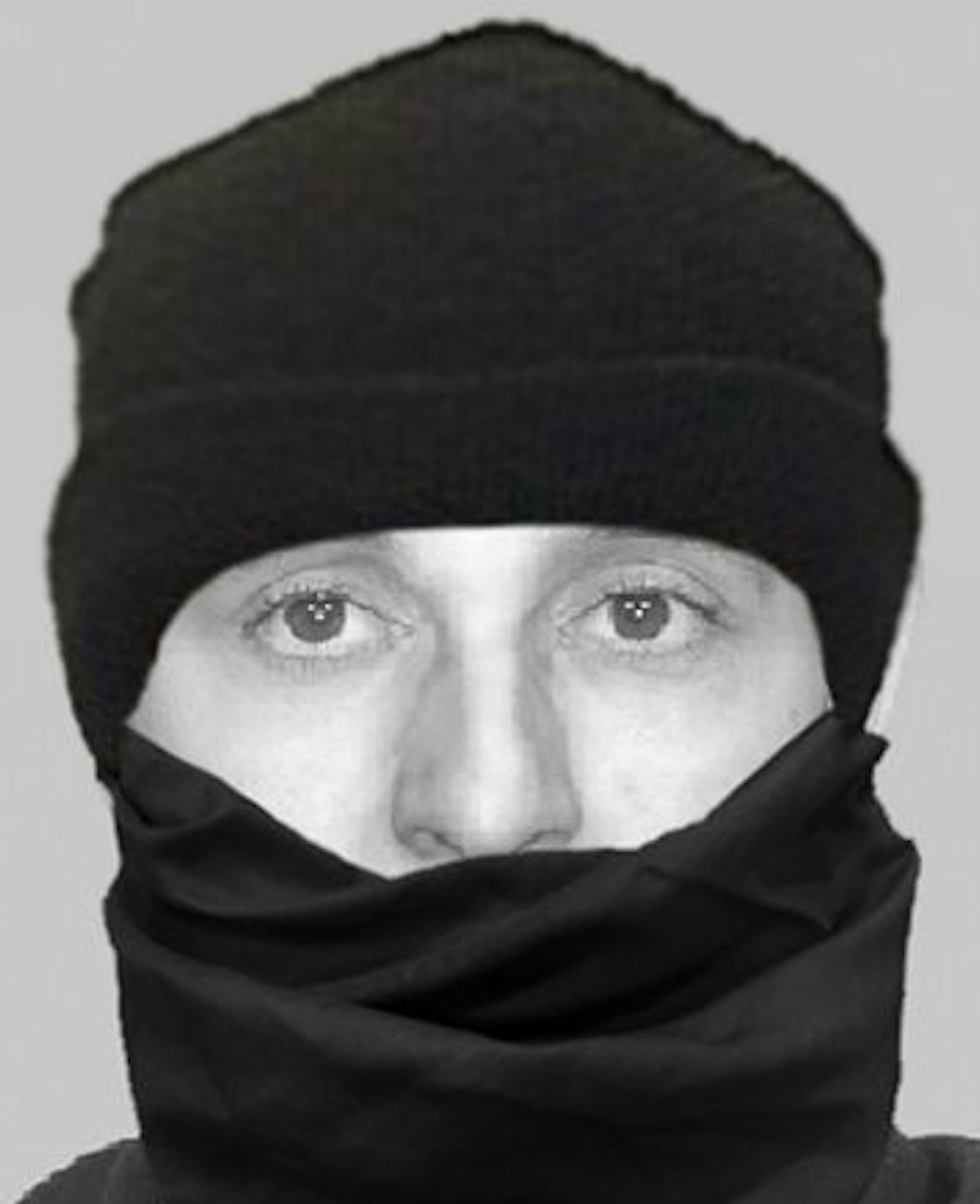 Das Schwarz-Weiß-Bild zeigt einen vermummten Mann, von dem nur die Augen- und Nasenpartie zu sehen ist.