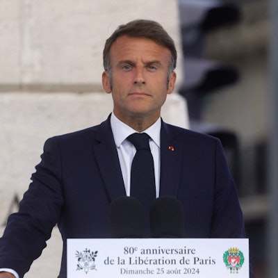 TOPSHOT - French President Emmanuel Macron delivers a speech during a ceremony commemorating the 80th anniversary of the Liberation of Paris next to the Denfert Rochereau Square, in Paris on August 25, 2024. Nazi Germany surrendered Paris on August 25, 1944, following the French Resistance uprising during World War II. (Photo by Teresa Suarez / POOL / AFP)