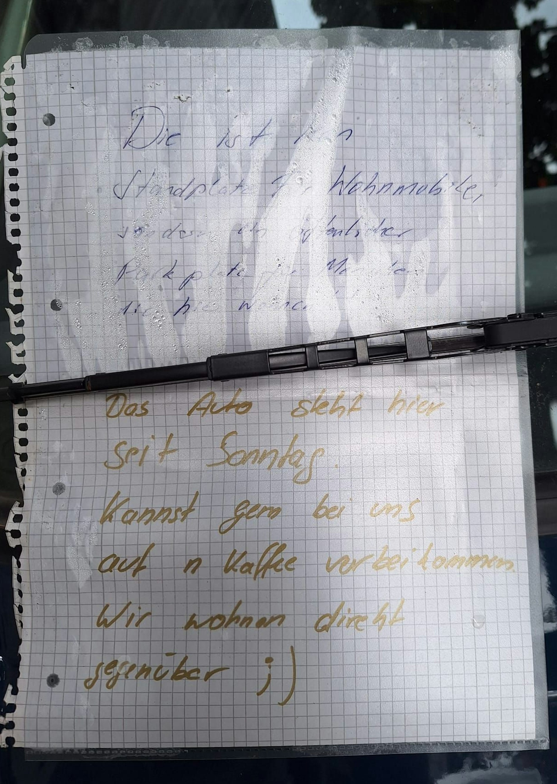 Ein Zettel an einem „Bulli“ in Köln.