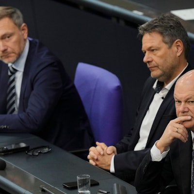 FILE - From right, German Chancellor Olaf Scholz, Economy and Climate Minister Robert Habeck and Finance Minister Christian Lindner listen to a debate about Germany's budget crisis at the parliament Bundestag in Berlin, Germany, Nov. 28, 2023. (AP Photo/Markus Schreiber, File)
