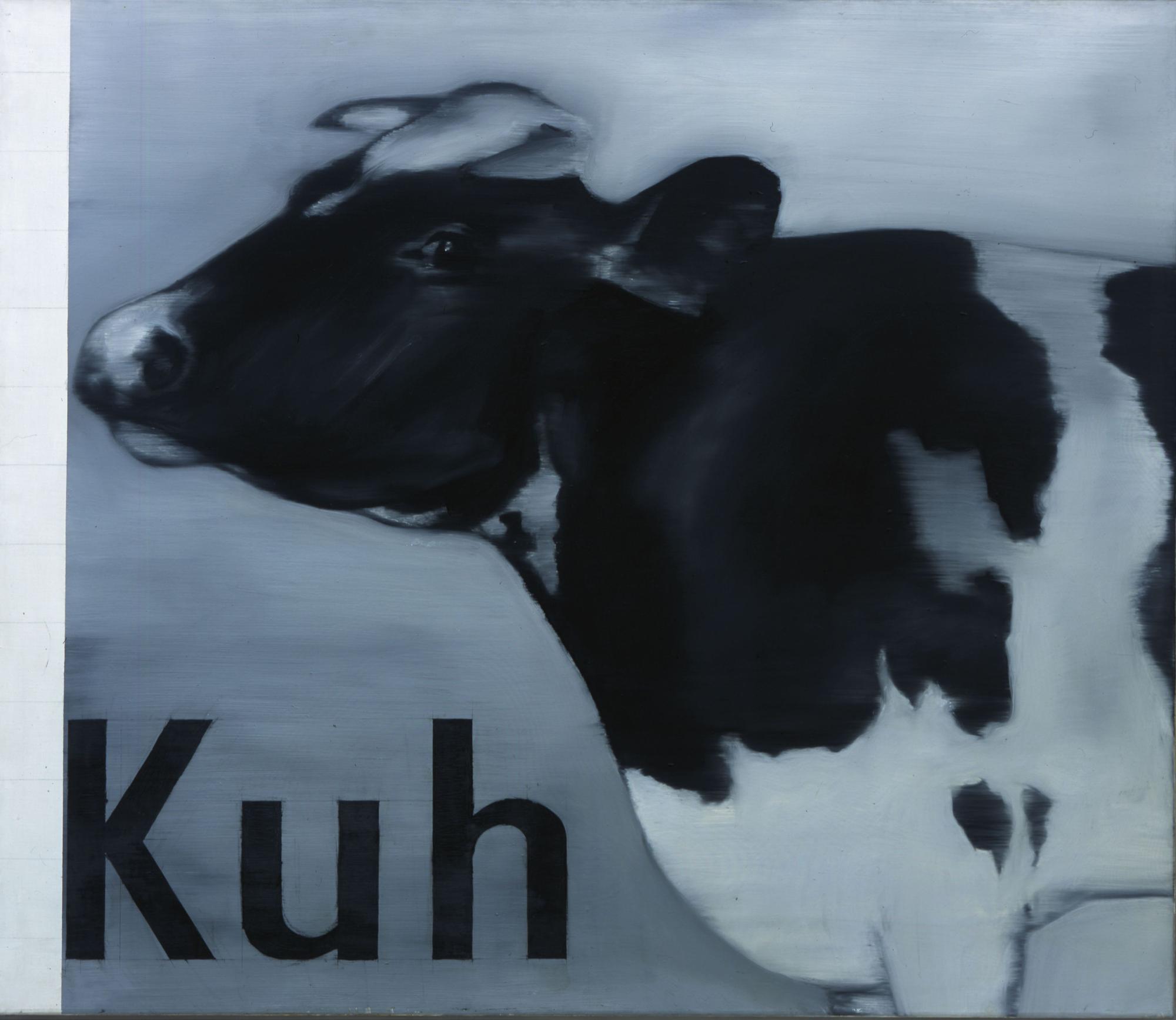 Eine gemalte Kuh steht neben dem Schriftzug Kuh.