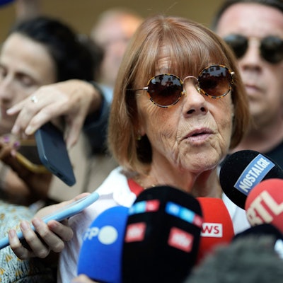 Gisele Pelicot speaks to media as she leaves the Avignon court house, southern France, Thursday, Sept. 5, 2024. A woman allegedly drugged by her ex-husband so that she could be raped by other men while she laid unconscious, is expected to testify before a panel of French judges. (AP Photo/Lewis Joly)
