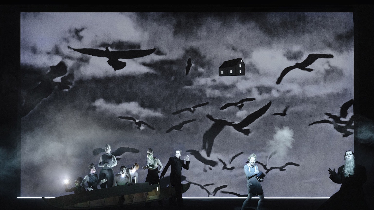 Moby Dick
von Herman Melville
Regie, Bühne, Licht: Robert Wilson — Songs und Lyrics: Anna Calvi
Regie, Bühne und Licht: Robert Wilson
Songs und Lyrics: Anna Calvi
Kostüm: Julia von Leliwa
Co-Regie: Ann-Christin Rommen
Co-Bühnenbild: Serge von Arx
Co-Lichtdesign: Marcello Lumaca
Video: Tomasz Jeziorski
Make-Up-Design: Manu Halligan
Music Supervisor und Arrangements: Chris Wheeler
Musikalische Leitung: Dom Bouffard
Orchester-Arrangements: Chris Wheeler
Sounddesign: Torben Kärst
Dramaturgie: Robert Koall
Dramaturgische Mitarbeit: Eli Troen
Auf dem Bild
Belendjwa Peter, Jonas Friedrich Leonhardi, Michael Fünfschilling, Roman Wieland, Moritz Klaus, Yaroslav Ros, Jürgen Sarkiss, Christopher Nell, Kilian Ponert
Foto: Lucie Jansch