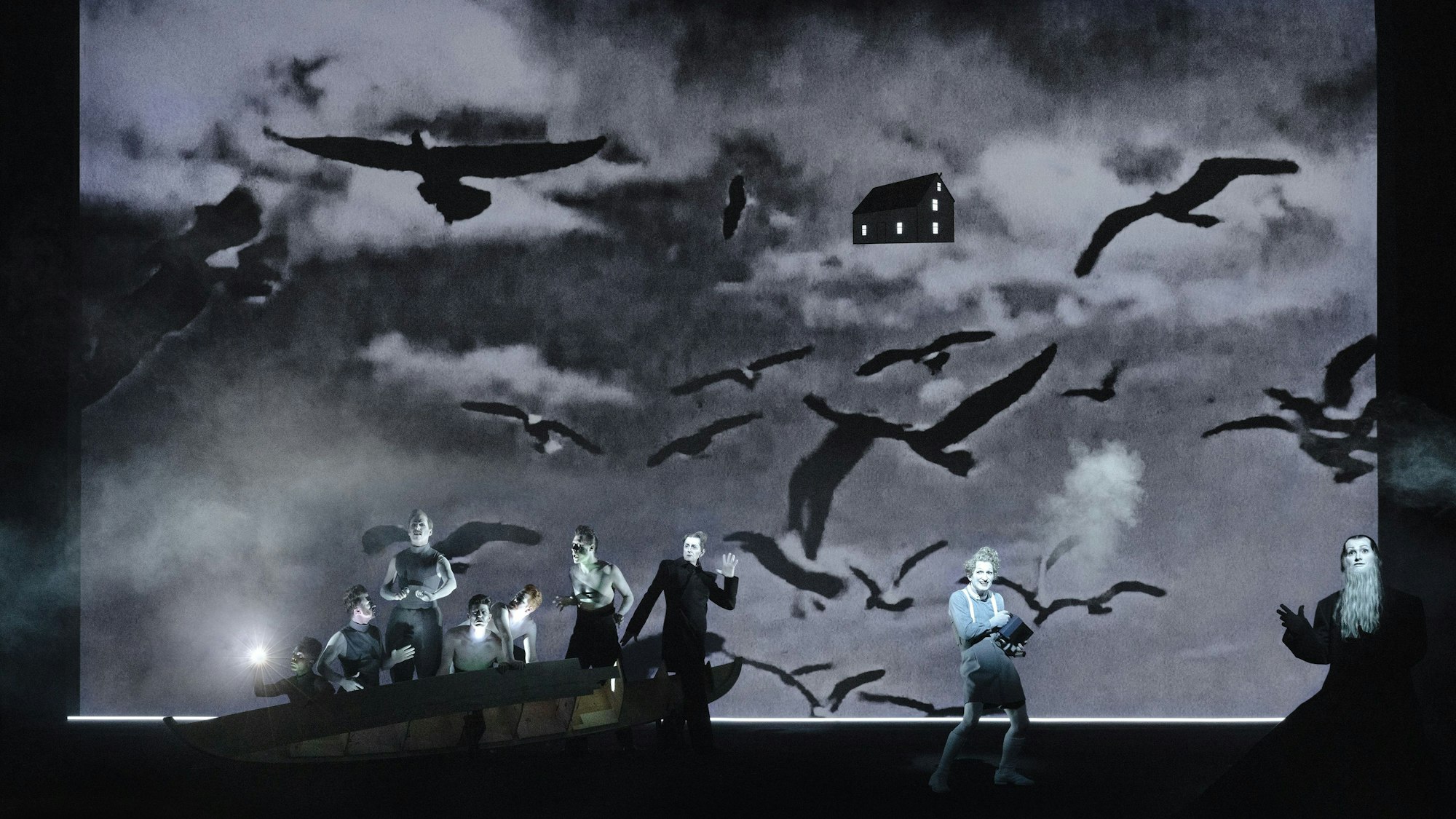 Moby Dick
von Herman Melville
Regie, Bühne, Licht: Robert Wilson — Songs und Lyrics: Anna Calvi
Regie, Bühne und Licht: Robert Wilson
Songs und Lyrics: Anna Calvi
Kostüm: Julia von Leliwa
Co-Regie: Ann-Christin Rommen
Co-Bühnenbild: Serge von Arx
Co-Lichtdesign: Marcello Lumaca
Video: Tomasz Jeziorski
Make-Up-Design: Manu Halligan
Music Supervisor und Arrangements: Chris Wheeler
Musikalische Leitung: Dom Bouffard
Orchester-Arrangements: Chris Wheeler
Sounddesign: Torben Kärst
Dramaturgie: Robert Koall
Dramaturgische Mitarbeit: Eli Troen
Auf dem Bild
Belendjwa Peter, Jonas Friedrich Leonhardi, Michael Fünfschilling, Roman Wieland, Moritz Klaus, Yaroslav Ros, Jürgen Sarkiss, Christopher Nell, Kilian Ponert
Foto: Lucie Jansch