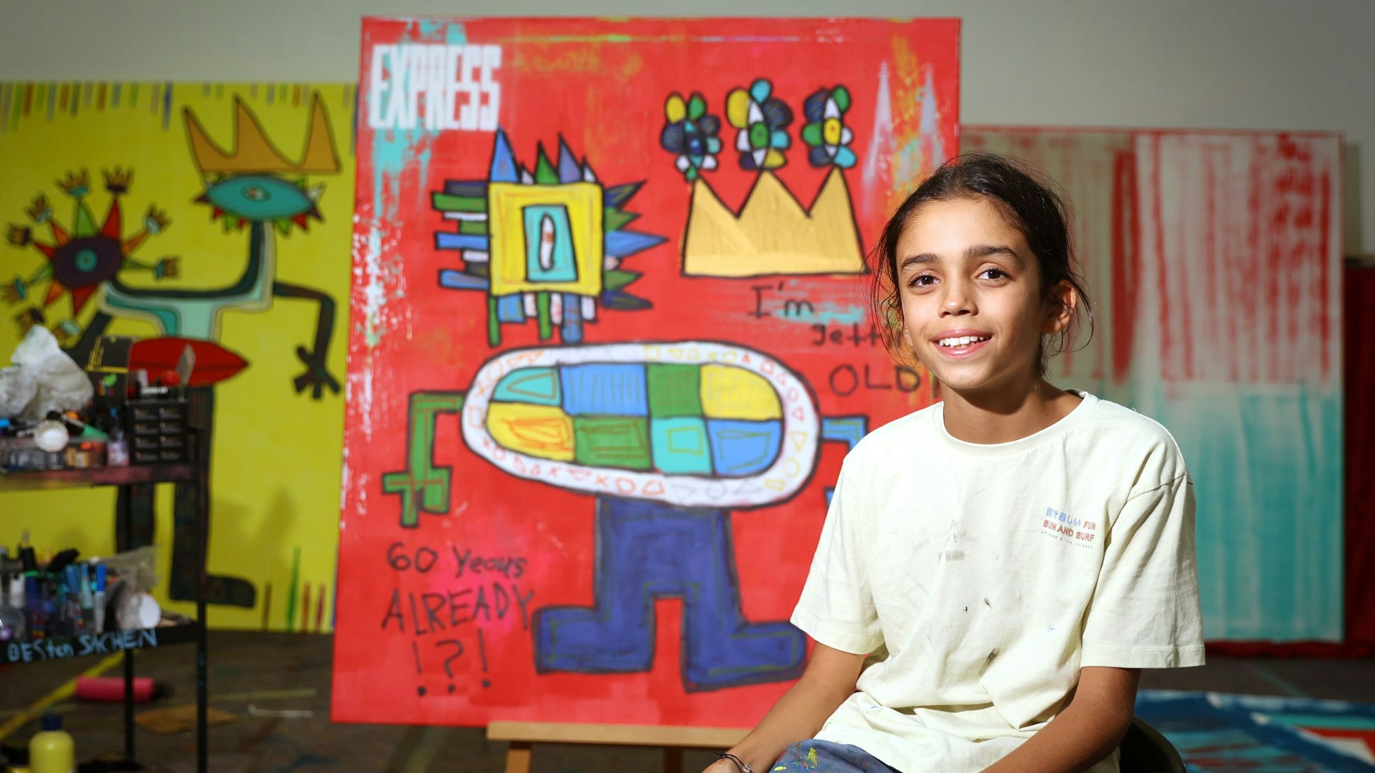 Kölns Wunderkind und Künstler Mikail Akar (11) hat ein Bild zum 60. Express-Geburtstag gemalt, das jetzt für„ wir helfen“ versteigert wird.