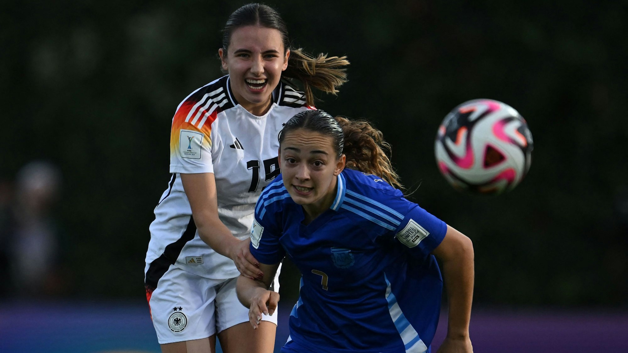 Germany's midfielder Loreen Bender (L) and Argentina's midfielder Delfina Lombardi fight for the ball during the 2024 FIFA U-20 Women's World Cup round of 16 match between Germany and Argentina at Metropolitano de Techo stadium in Bogota on September 12, 2024. (Photo by Raul ARBOLEDA / AFP)