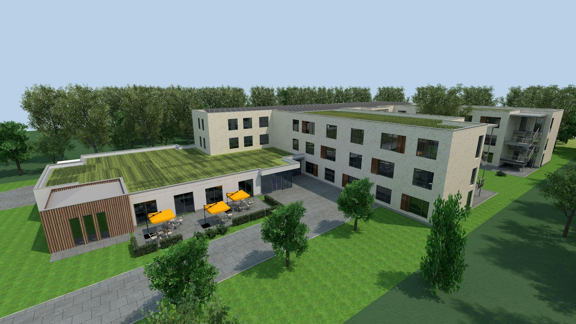 Die Visualisierung zeigt einen von viel Grün umgebenen Gebäudekomplex,