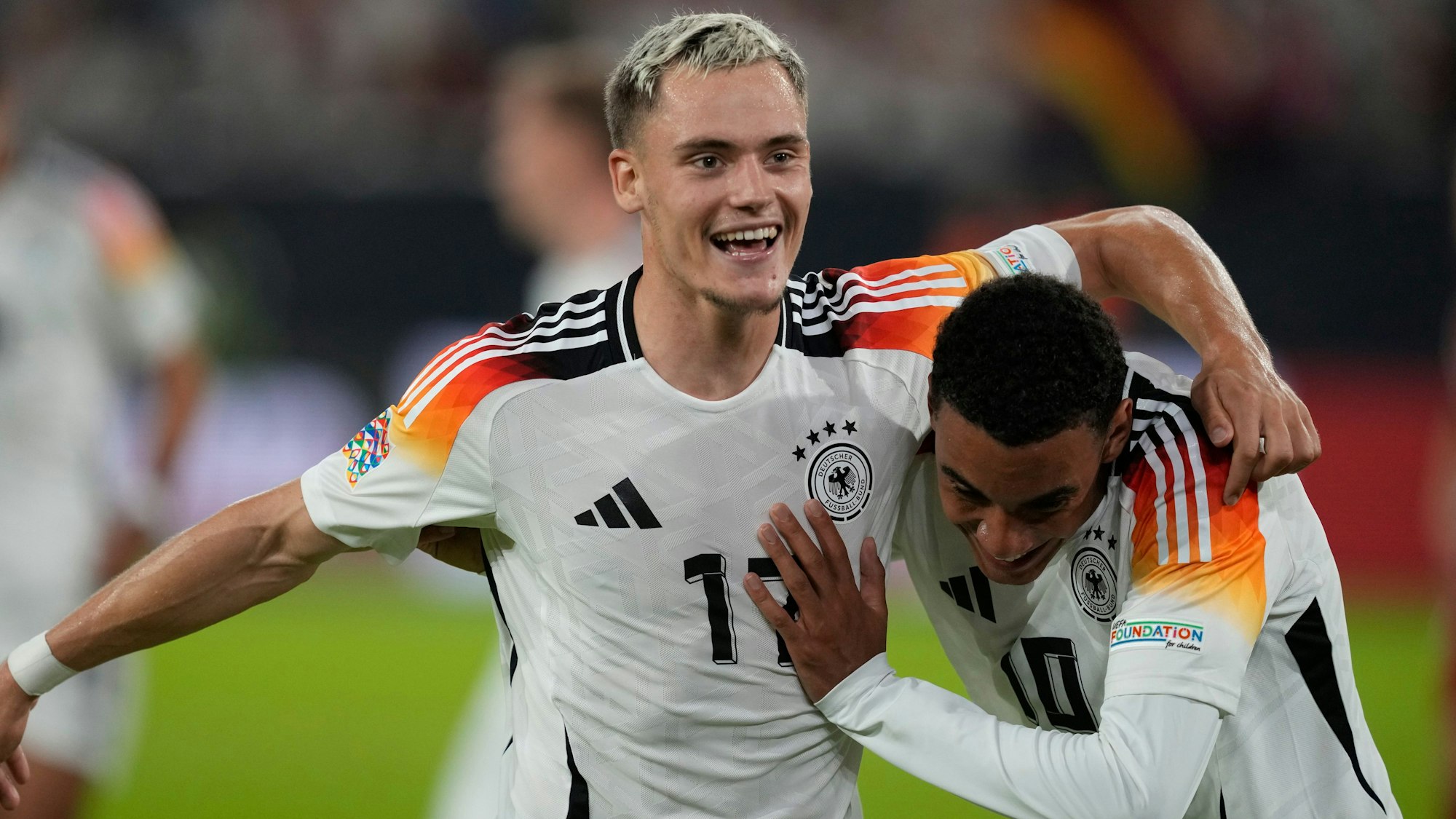 Germany's Florian Wirtz, left, celebrates with Jamal Musiala after scoring his side's third goal during the UEFA Nations League soccer match between Germany and Hungary at the Merkur Spiel-Arena in Dusseldorf, Germany, Saturday, Sept. 7, 2024. (AP Photo/Michael Probst)
