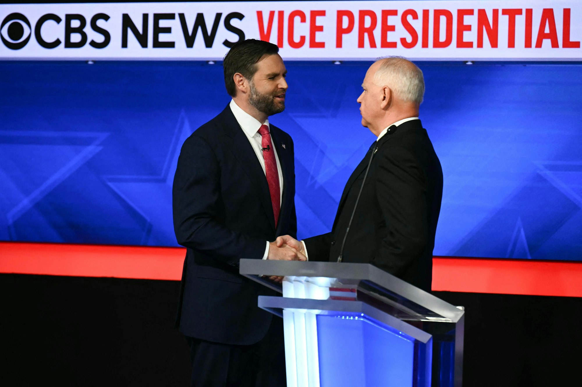 TOPSHOT - US Senator and Republican vice presidential candidate J.D. Vance (L) and Minnesota Governor and Democratic vice presidential candidate Tim Walz shake hands at the end of the Vice Presidential debate hosted by CBS News at the CBS Broadcast Center in New York City on October 1, 2024. (Photo by ANGELA WEISS / AFP)