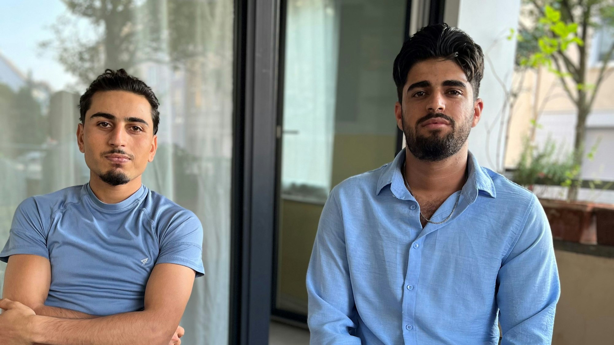 Porträt der Geflüchteten Aziz und Nasrullah