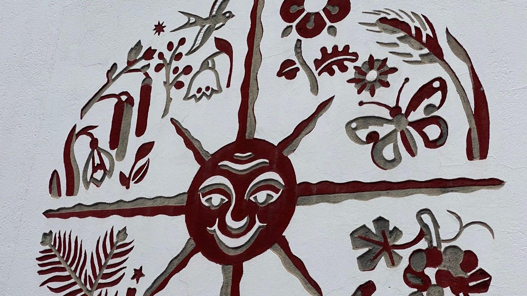 Zu sehen ist das Symbol einer Sonne.