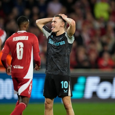 Leverkusen's Florian Wirtz reacts after missing a chance to score during the Champions League opening phase soccer match between Brest and Bayer Leverkusen in Guingamp, western France, Wednesday, Oct. 23, 2024. (AP Photo/Christophe Ena)