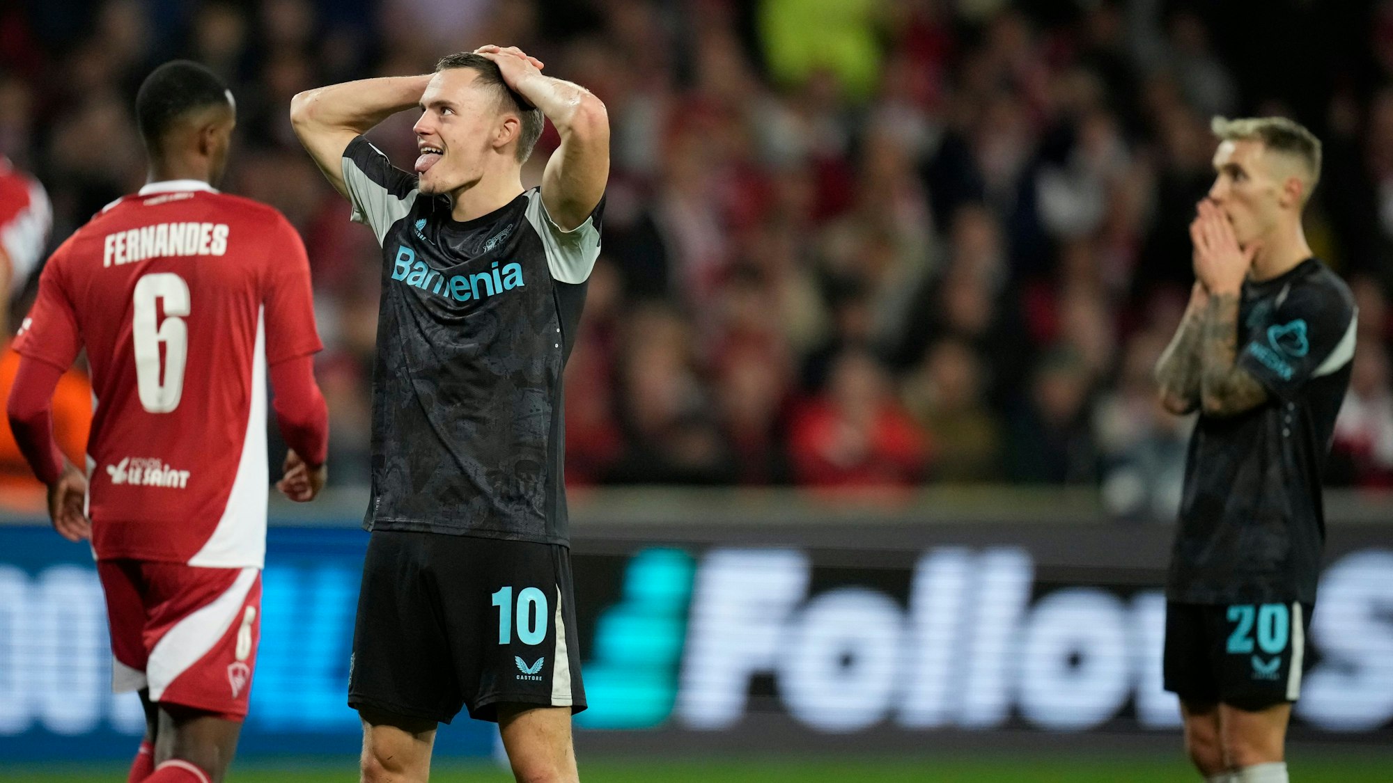 Leverkusen's Florian Wirtz reacts after missing a chance to score during the Champions League opening phase soccer match between Brest and Bayer Leverkusen in Guingamp, western France, Wednesday, Oct. 23, 2024. (AP Photo/Christophe Ena)