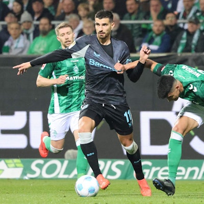 Bayer Leverkusen's French forward #11 Martin Terrier and Bremen's Argentinia defender #22 Julian Malatini vie for the ball during the German first division Bundesliga football match between SV Werder Bremen and Bayer Leverkusen in Bremen, northern Germany on October 26, 2024. (Photo by Focke Strangmann / AFP) / DFL REGULATIONS PROHIBIT ANY USE OF PHOTOGRAPHS AS IMAGE SEQUENCES AND/OR QUASI-VIDEO